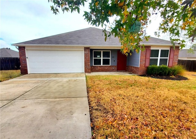 ranch-style home featuring a garage and a front yard