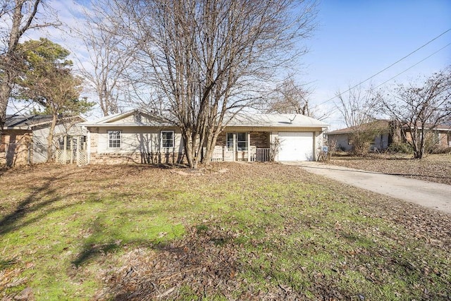 single story home with a front yard and a garage