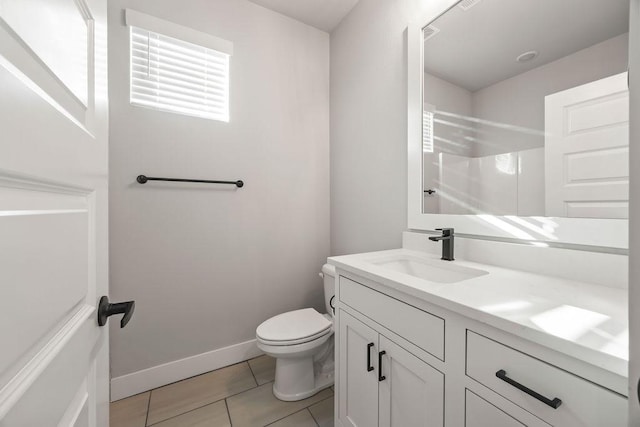 bathroom featuring toilet, walk in shower, tile patterned floors, and vanity