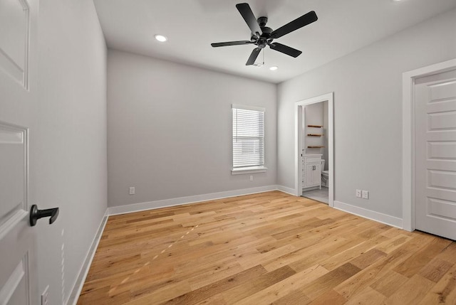 unfurnished bedroom with ceiling fan, light hardwood / wood-style flooring, and ensuite bath