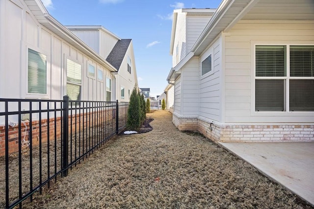 view of side of property featuring a patio