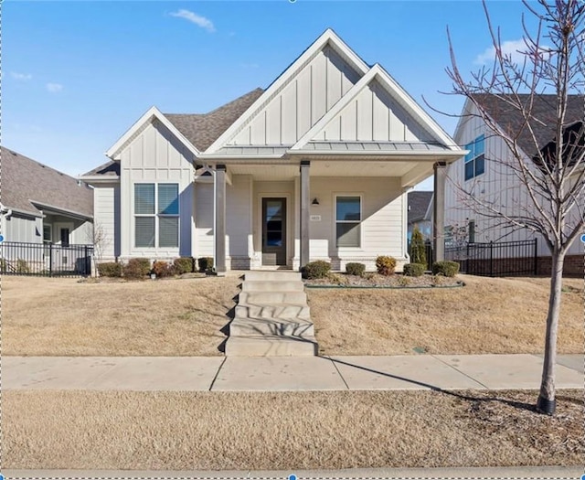 view of front of property with a front yard and a porch