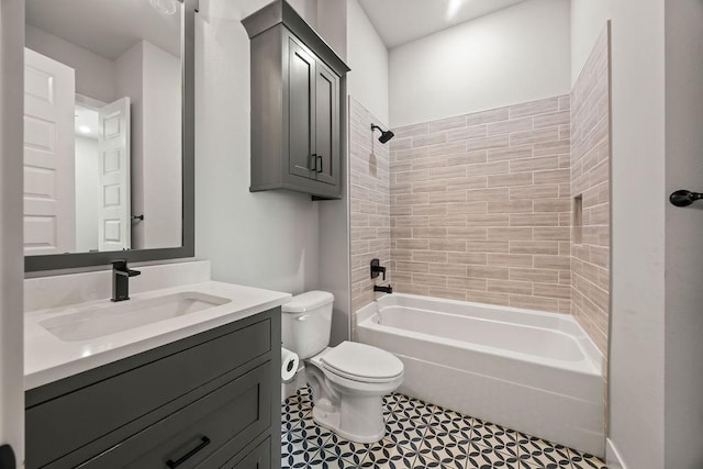 full bathroom featuring toilet, tiled shower / bath combo, and vanity