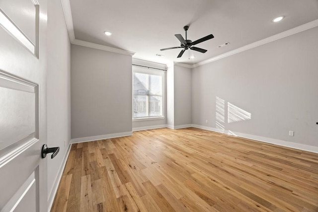 spare room featuring ceiling fan, crown molding, and light hardwood / wood-style flooring