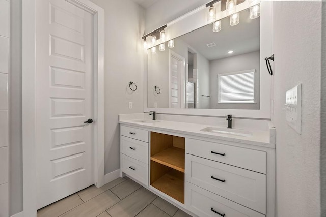 bathroom with tile patterned floors and vanity