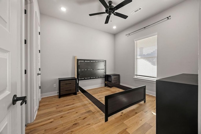 bedroom featuring ceiling fan and light hardwood / wood-style flooring