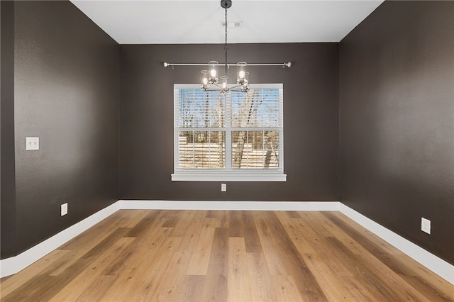 29 Shanklin Dr, Bella Vista, AR 72715 - unfurnished dining area with a chandelier and wood finished floors