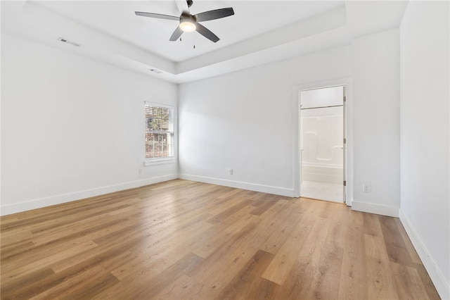 29 Shanklin Dr, Bella Vista, AR 72715 - unfurnished room with a tray ceiling, a ceiling fan, and light wood finished floors