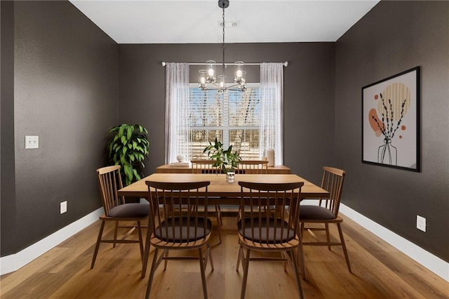 29 Shanklin Dr, Bella Vista, AR 72715 - dining area with light wood-type flooring and a chandelier