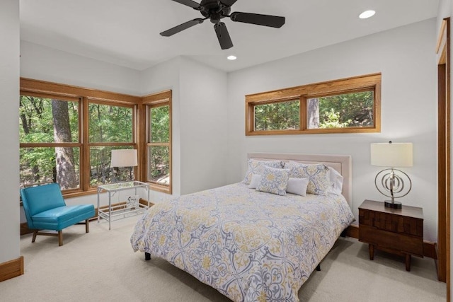 bedroom featuring ceiling fan and light colored carpet