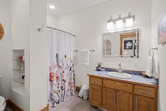 bathroom with walk in shower, vanity, toilet, and tile patterned flooring