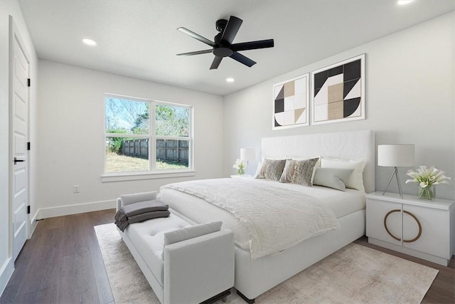 bedroom with ceiling fan and hardwood / wood-style flooring