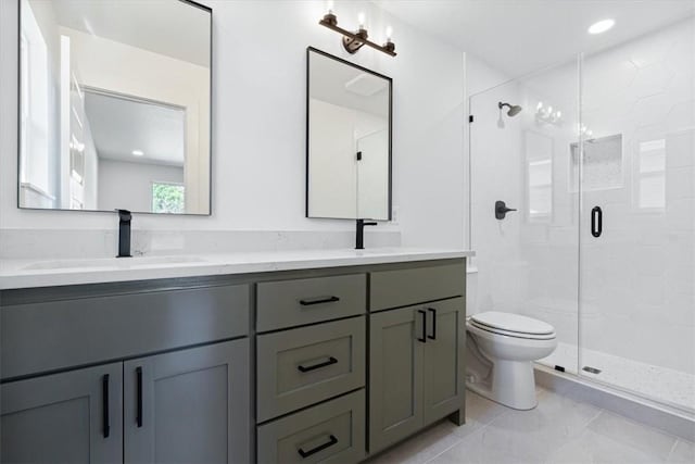 bathroom featuring walk in shower, vanity, and toilet