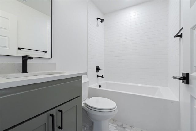 full bathroom featuring toilet, tiled shower / bath, and vanity