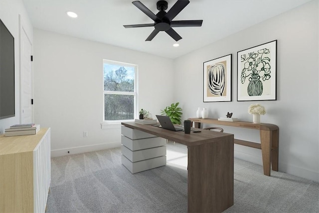 carpeted office with ceiling fan