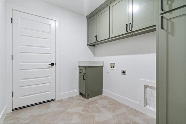 laundry area with washer hookup, cabinets, and electric dryer hookup