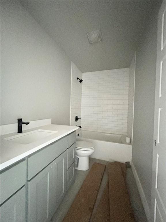 full bathroom featuring toilet, vanity, and tiled shower / bath combo