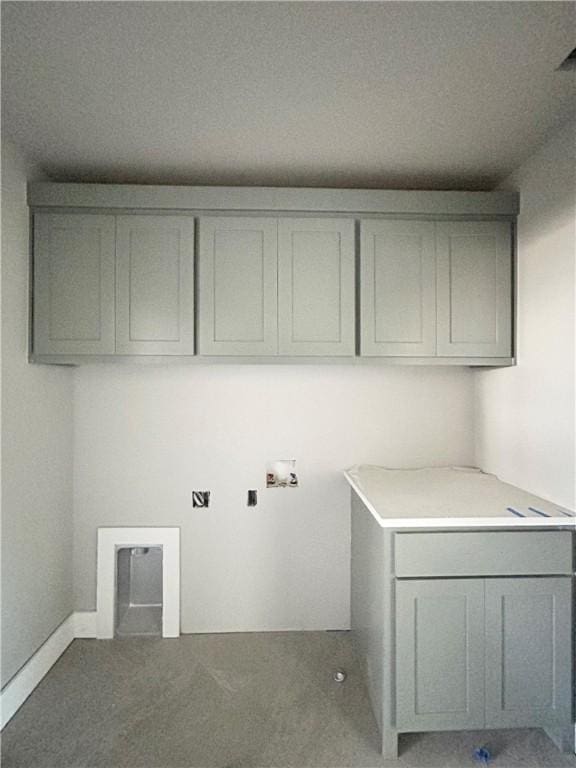 laundry room featuring washer hookup and cabinets