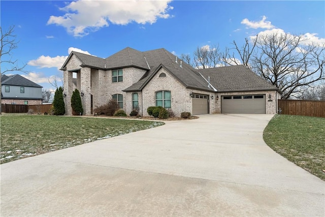 view of front of home featuring a garage and a front yard