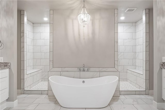 bathroom with vanity, a notable chandelier, and independent shower and bath