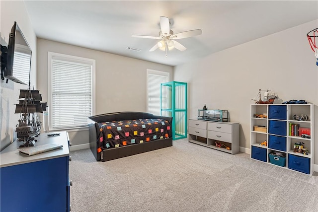 carpeted bedroom with ceiling fan