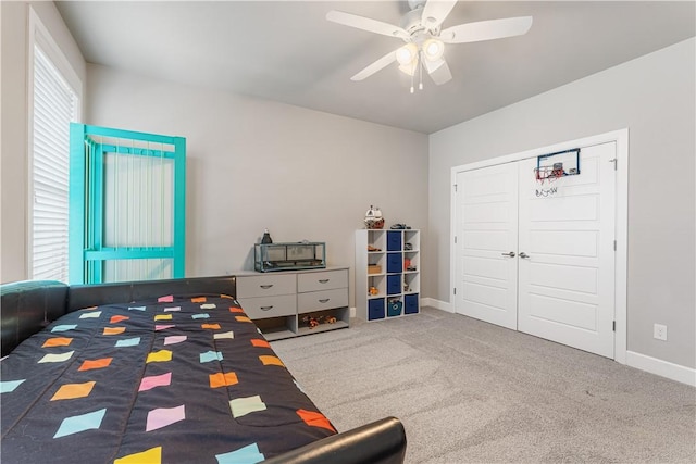 bedroom with ceiling fan, a closet, and carpet floors