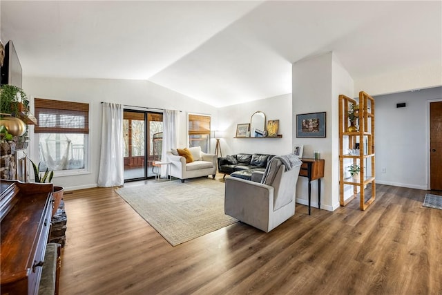 living room featuring dark wood-type flooring and lofted ceiling