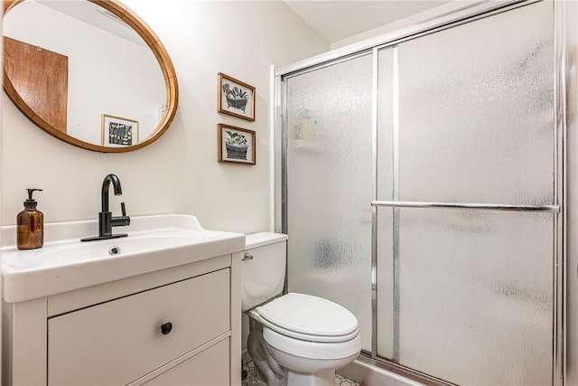 bathroom with a shower with door, toilet, and vanity