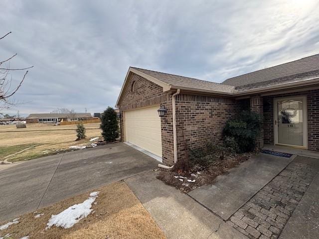 view of property exterior featuring a garage