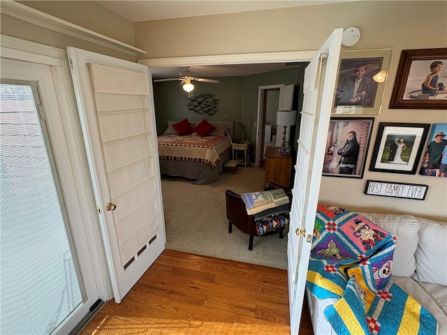 bedroom featuring ceiling fan and hardwood / wood-style flooring