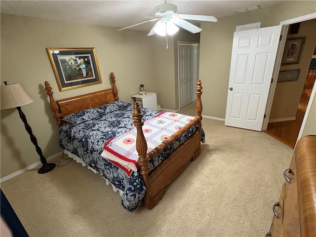 bedroom with ceiling fan and carpet floors