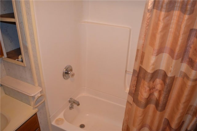 bathroom with vanity and shower / tub combo