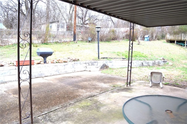 view of patio / terrace featuring fence