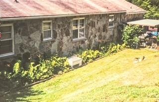 view of home's exterior featuring a lawn