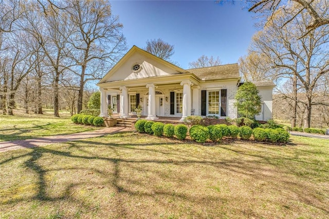 greek revival house with a front lawn