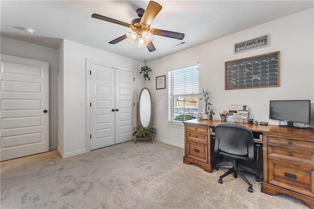 office area featuring ceiling fan and light colored carpet