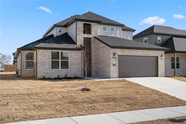 view of front of house with a front yard and a garage