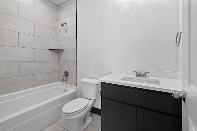 full bathroom featuring tile patterned floors, toilet, vanity, and tiled shower / bath combo