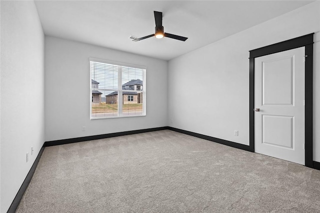 carpeted empty room with ceiling fan