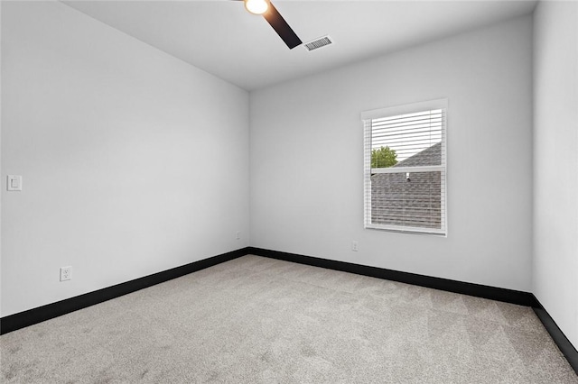 carpeted empty room with ceiling fan