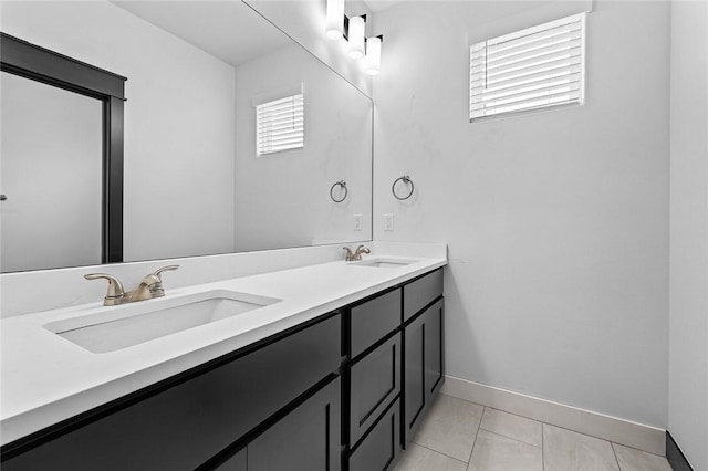 bathroom with tile patterned floors and vanity