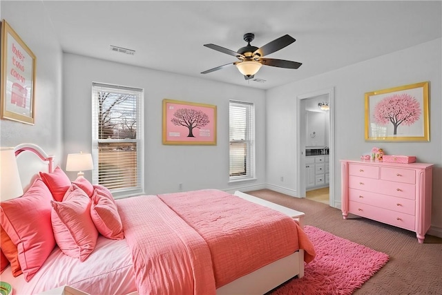 bedroom featuring ceiling fan, carpet floors, and ensuite bath