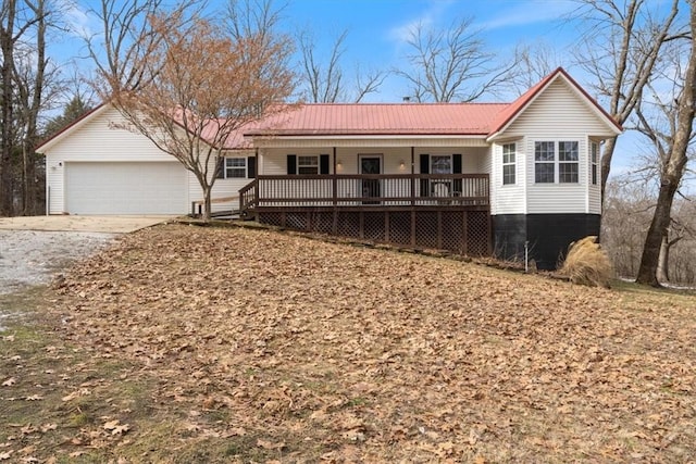 ranch-style house featuring a porch and a garage