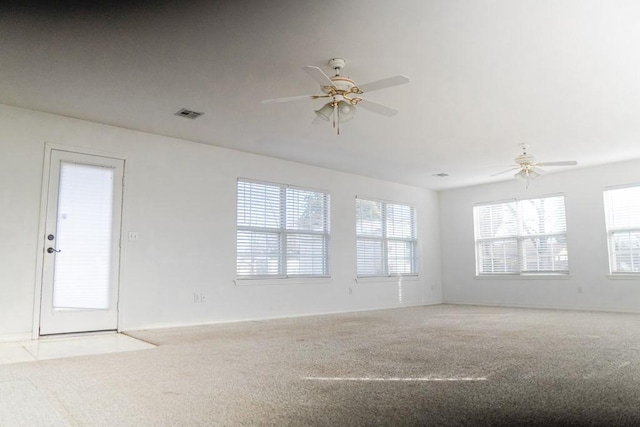 empty room with light carpet and ceiling fan