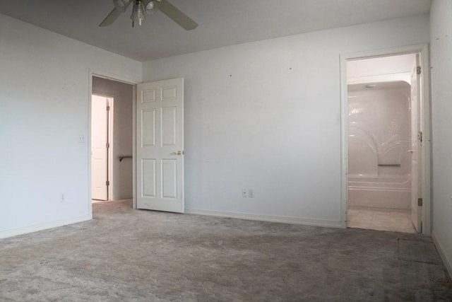 interior space featuring carpet floors and ensuite bathroom