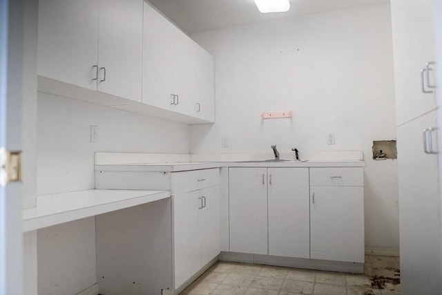 washroom featuring cabinets, sink, and washer hookup