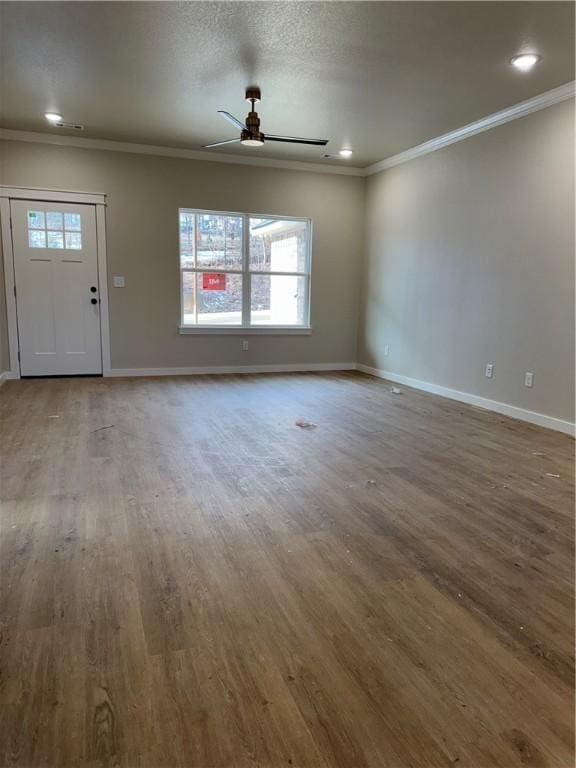 unfurnished living room with a textured ceiling, ceiling fan, crown molding, and hardwood / wood-style flooring