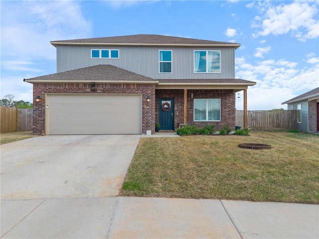 traditional-style house with concrete driveway, brick siding, fence, and a front yard