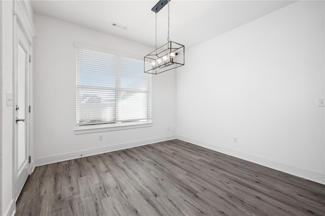 unfurnished dining area featuring hardwood / wood-style flooring