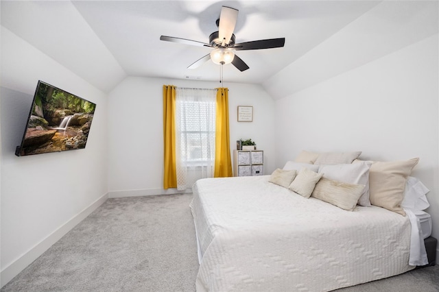 bedroom featuring ceiling fan, light carpet, and lofted ceiling